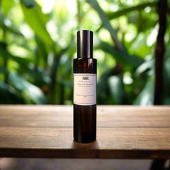 Bottle of Chamaeral hair oil on a white background
